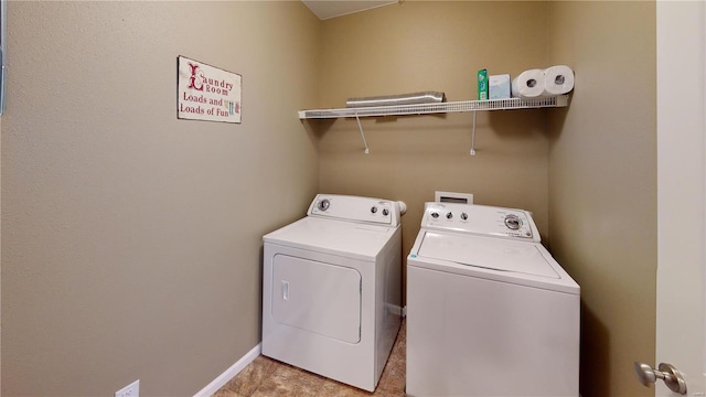 laundry room with independent washer and dryer and baseboards