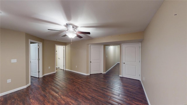 unfurnished room featuring ceiling fan, baseboards, and wood finished floors