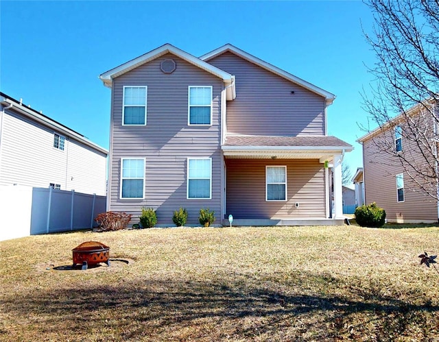 back of property featuring an outdoor fire pit and a porch