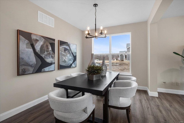 513 Beneficial Way, Saint Charles, MO 63304 - dining room with a chandelier, dark wood-style floors, and baseboards