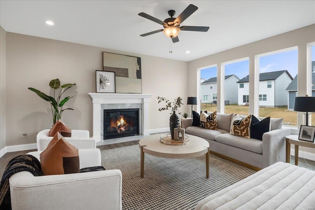 513 Beneficial Way, Saint Charles, MO 63304 - living room featuring baseboards, ceiling fan, wood finished floors, a fireplace, and recessed lighting