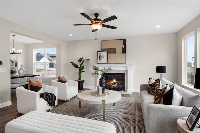 513 Beneficial Way, Saint Charles, MO 63304 - living room with wood finished floors, a high end fireplace, a ceiling fan, baseboards, and recessed lighting