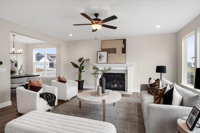 513 Beneficial Way, Saint Charles, MO 63304 - living area with wood finished floors, a premium fireplace, a ceiling fan, baseboards, and recessed lighting