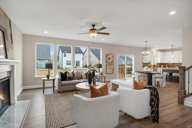 513 Beneficial Way, Saint Charles, MO 63304 - living room with plenty of natural light, a fireplace, wood finished floors, baseboards, and recessed lighting