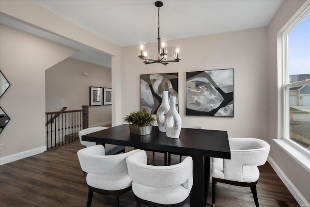 513 Beneficial Way, Saint Charles, MO 63304 - dining area featuring a chandelier, dark wood-style floors, and baseboards