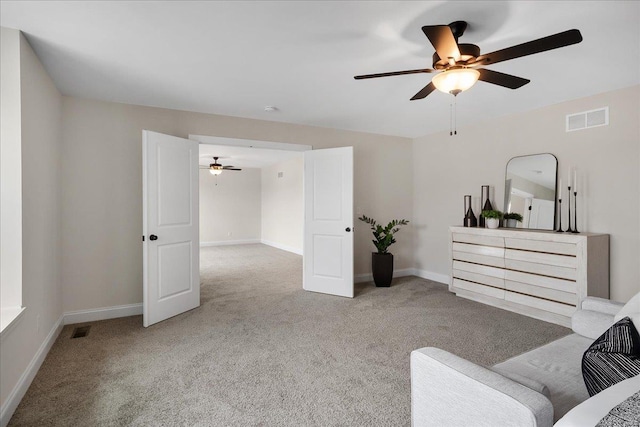513 Beneficial Way, Saint Charles, MO 63304 - living area featuring ceiling fan, carpet flooring, and baseboards
