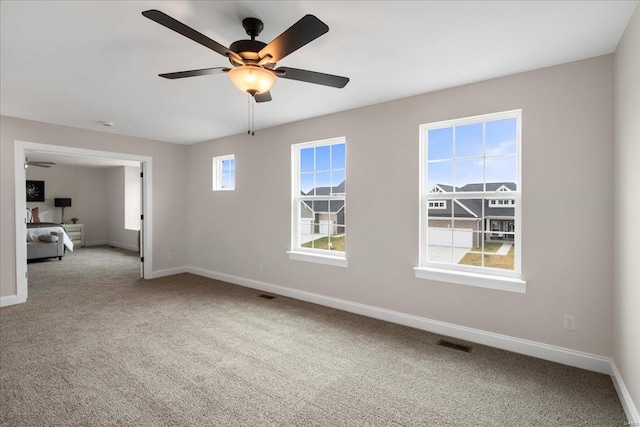 513 Beneficial Way, Saint Charles, MO 63304 - carpeted spare room with a ceiling fan and baseboards