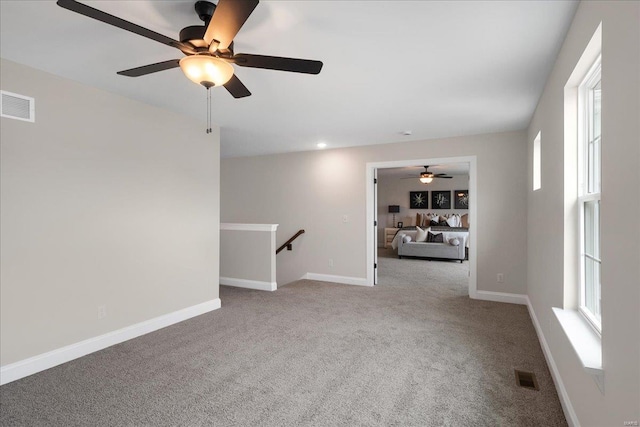 513 Beneficial Way, Saint Charles, MO 63304 - empty room featuring a ceiling fan, carpet, and baseboards