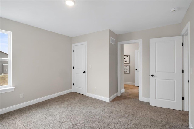513 Beneficial Way, Saint Charles, MO 63304 - unfurnished bedroom featuring carpet flooring and baseboards