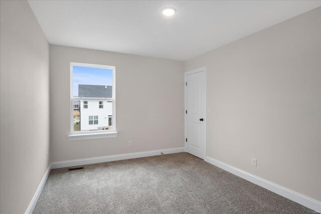 513 Beneficial Way, Saint Charles, MO 63304 - spare room with carpet floors and baseboards
