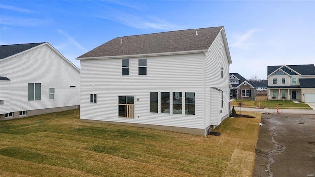 513 Beneficial Way, Saint Charles, MO 63304 - back of property featuring a yard and roof with shingles