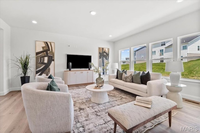513 Beneficial Way, Saint Charles, MO 63304 - living area featuring light wood-type flooring, baseboards, and recessed lighting