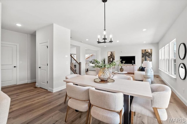 513 Beneficial Way, Saint Charles, MO 63304 - dining room featuring stairway, light wood-style flooring, a chandelier, recessed lighting, and baseboards