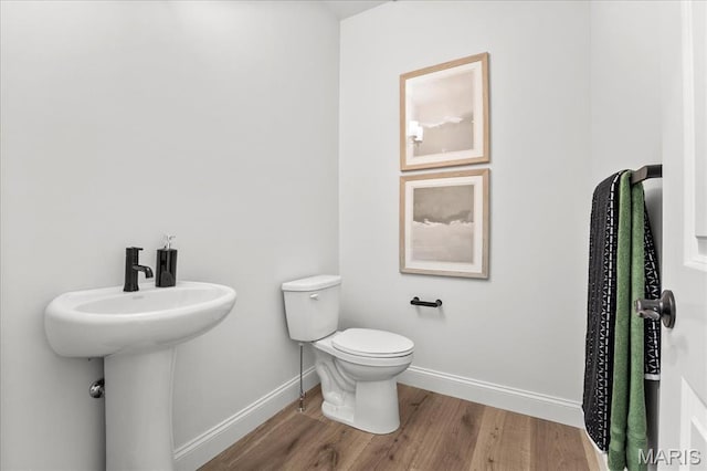 513 Beneficial Way, Saint Charles, MO 63304 - half bathroom with wood finished floors, baseboards, and toilet