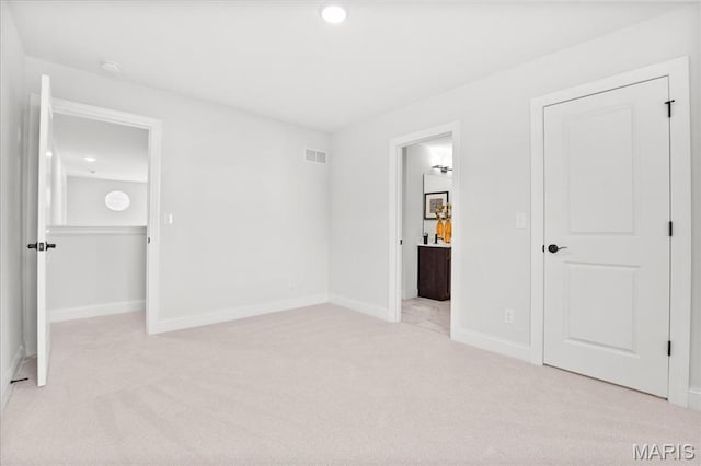 513 Beneficial Way, Saint Charles, MO 63304 - unfurnished bedroom featuring light carpet, ensuite bathroom, baseboards, and recessed lighting