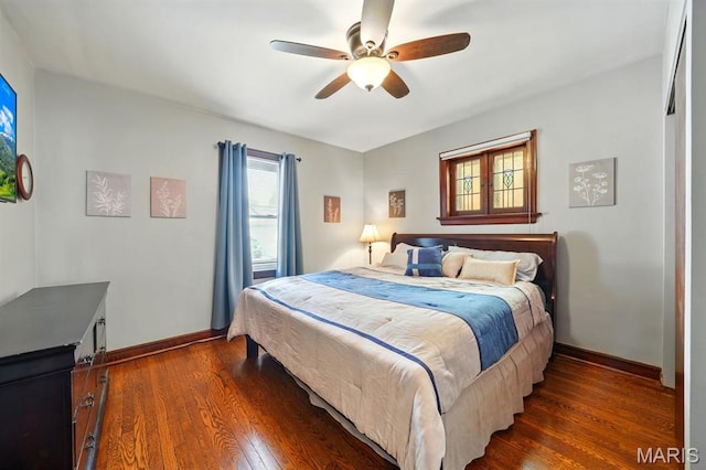 4355 Toenges Ave, Saint Louis, MO 63116 - bedroom with dark wood-style flooring, baseboards, and ceiling fan