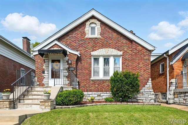 4355 Toenges Ave, Saint Louis, MO 63116 - view of front of home with brick siding and a front lawn