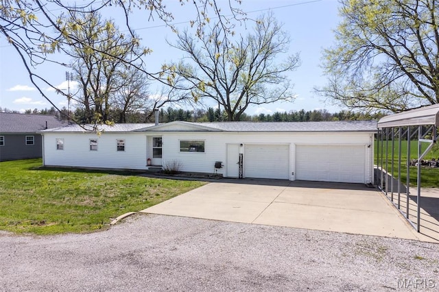 2 S Circle Dr, Carlyle, IL 62231 - view of front of home with a front lawn, a garage, and driveway