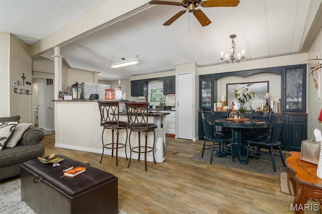 2 S Circle Dr, Carlyle, IL 62231 - living room featuring a ceiling fan, wood finished floors, and a chandelier