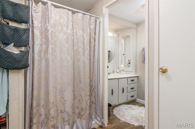2 S Circle Dr, Carlyle, IL 62231 - full bath featuring wood finished floors, vanity, and a shower with curtain