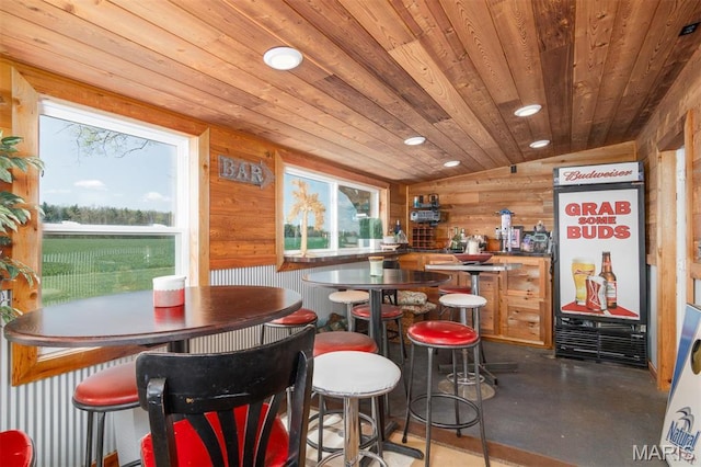 2 S Circle Dr, Carlyle, IL 62231 - bar area with wooden ceiling, wood walls, vaulted ceiling, finished concrete floors, and recessed lighting