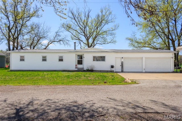 2 S Circle Dr, Carlyle, IL 62231 - single story home with an attached garage, concrete driveway, and a front yard