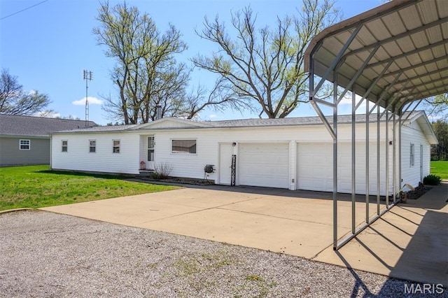 2 S Circle Dr, Carlyle, IL 62231 - ranch-style house featuring concrete driveway, a front lawn, and a garage