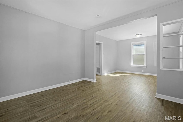 2430 Wallis Ave, Saint Louis, MO 63114 - unfurnished room with baseboards and dark wood finished floors