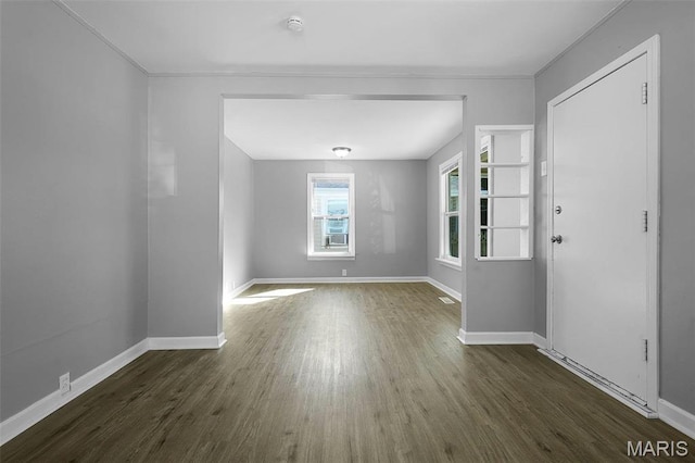 2430 Wallis Ave, Saint Louis, MO 63114 - empty room with dark wood-style floors, baseboards, and crown molding