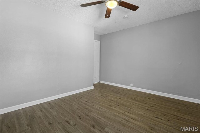 2430 Wallis Ave, Saint Louis, MO 63114 - empty room with ceiling fan, dark wood-style flooring, a textured ceiling, and baseboards