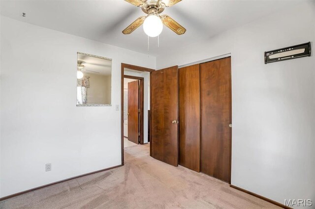 6072 Kingsway, House Springs, MO 63051 - unfurnished bedroom with light colored carpet, a closet, ceiling fan, and baseboards