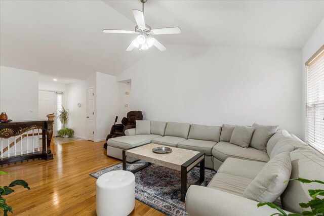 9 Amber Ridge Ct, High Ridge, MO 63049 - living area featuring vaulted ceiling, light wood-type flooring, a ceiling fan, and baseboards