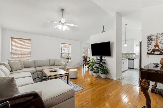 9 Amber Ridge Ct, High Ridge, MO 63049 - living area featuring ceiling fan, light wood-style floors, high vaulted ceiling, and baseboards