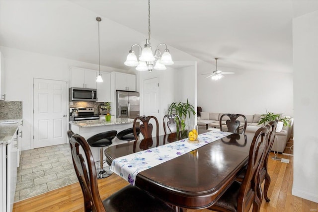 9 Amber Ridge Ct, High Ridge, MO 63049 - dining room featuring a ceiling fan, lofted ceiling, and a chandelier