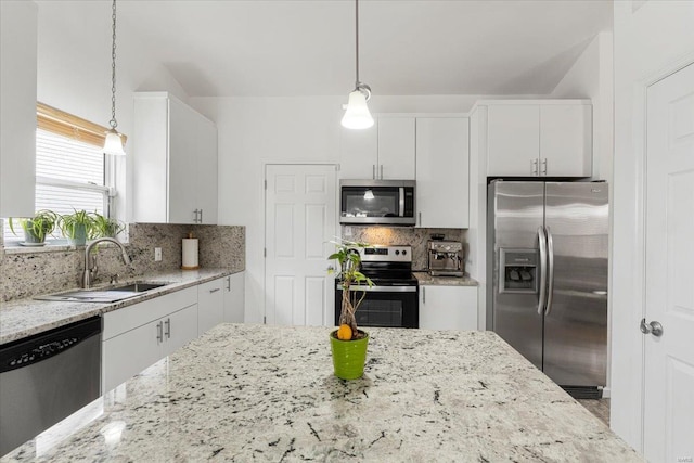 9 Amber Ridge Ct, High Ridge, MO 63049 - kitchen featuring stainless steel appliances, white cabinetry, and backsplash