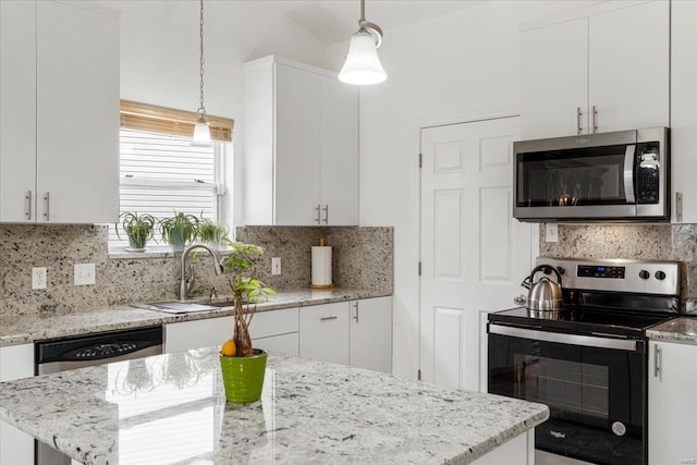 9 Amber Ridge Ct, High Ridge, MO 63049 - kitchen featuring stainless steel appliances, a sink, white cabinetry, backsplash, and pendant lighting