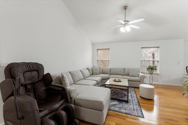 9 Amber Ridge Ct, High Ridge, MO 63049 - living area with plenty of natural light, a ceiling fan, light wood-style floors, baseboards, and high vaulted ceiling