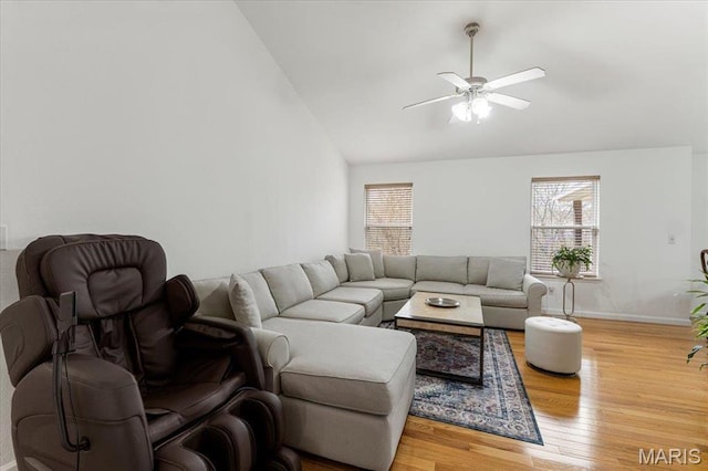 9 Amber Ridge Ct, High Ridge, MO 63049 - living area with healthy amount of natural light, ceiling fan, light wood-style floors, high vaulted ceiling, and baseboards