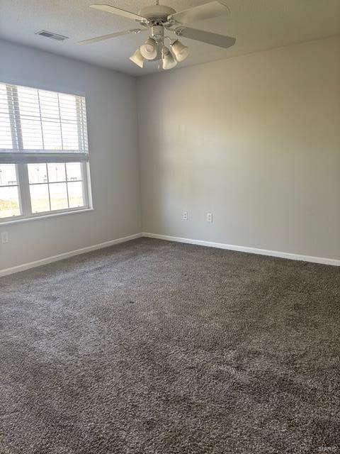 708 Michael St, Ofallon, IL 62269 - empty room featuring baseboards, carpet floors, and a ceiling fan
