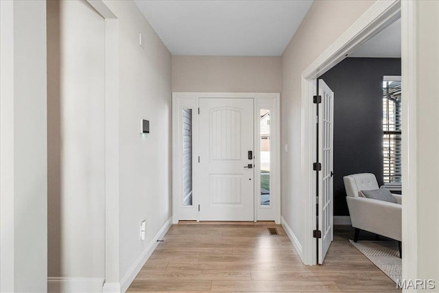 504 Coppice Ct, Wentzville, MO 63385 - foyer with light wood-style flooring and baseboards