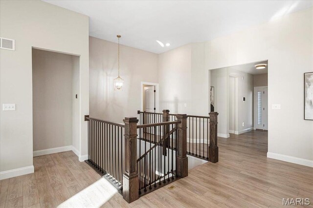 504 Coppice Ct, Wentzville, MO 63385 - corridor with an upstairs landing, wood finished floors, and baseboards