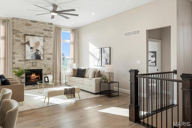 504 Coppice Ct, Wentzville, MO 63385 - living area featuring a ceiling fan, wood finished floors, a fireplace, baseboards, and recessed lighting