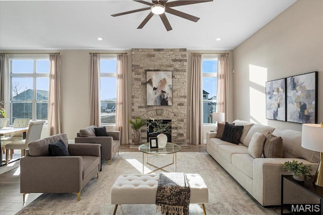 504 Coppice Ct, Wentzville, MO 63385 - living room featuring ceiling fan, healthy amount of natural light, light wood-type flooring, a fireplace, and recessed lighting