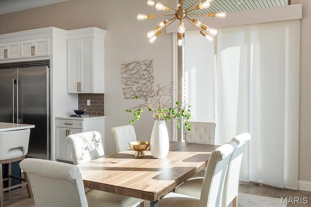 504 Coppice Ct, Wentzville, MO 63385 - dining space featuring light wood-type flooring and a chandelier