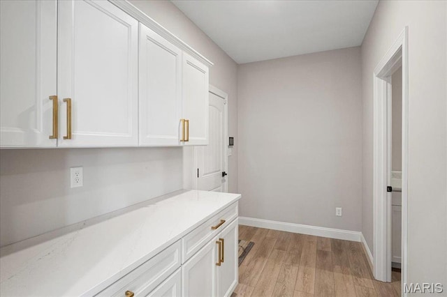 504 Coppice Ct, Wentzville, MO 63385 - hallway featuring light wood-style floors and baseboards
