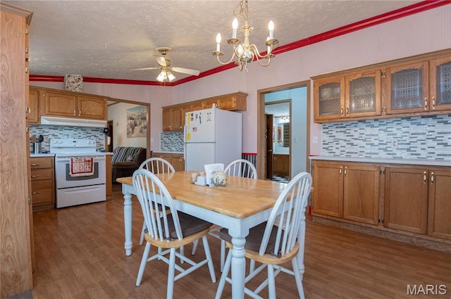 751 High St, Edgar Springs, MO 65462 - dining area featuring a textured ceiling, ceiling fan, wood finished floors, a chandelier, and ornamental molding