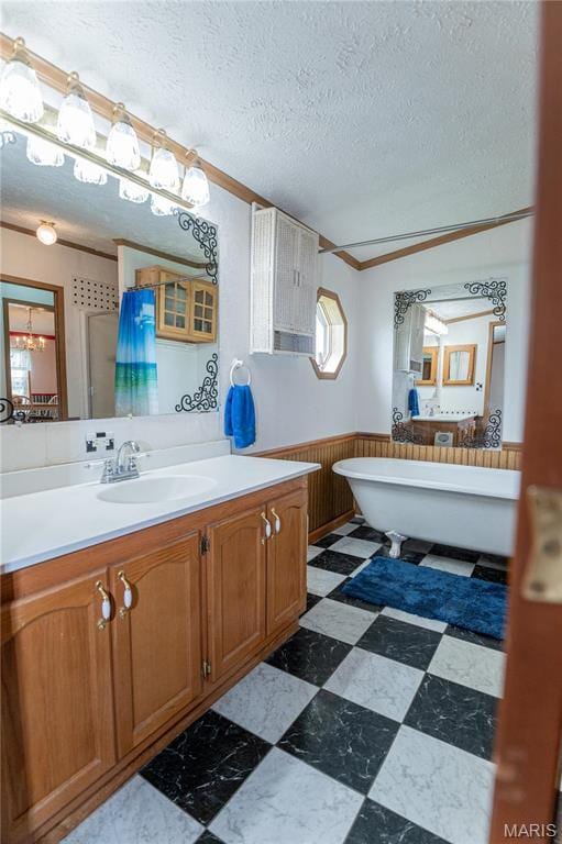 751 High St, Edgar Springs, MO 65462 - full bath featuring a shower stall, a wainscoted wall, a textured ceiling, ornamental molding, and vanity
