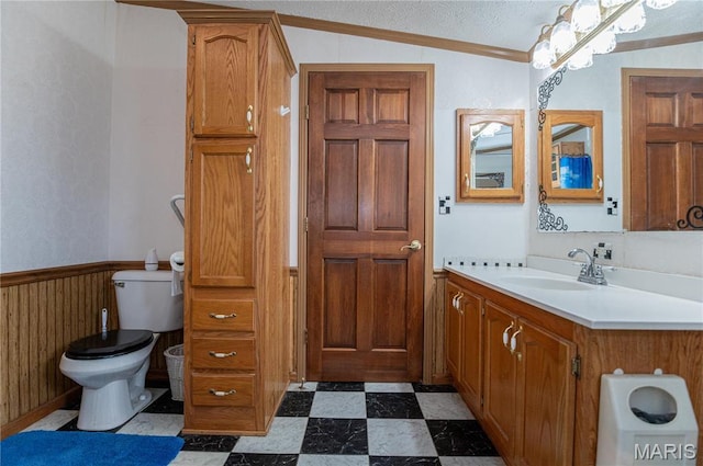 751 High St, Edgar Springs, MO 65462 - bathroom with toilet, tile patterned floors, ornamental molding, vanity, and a wainscoted wall