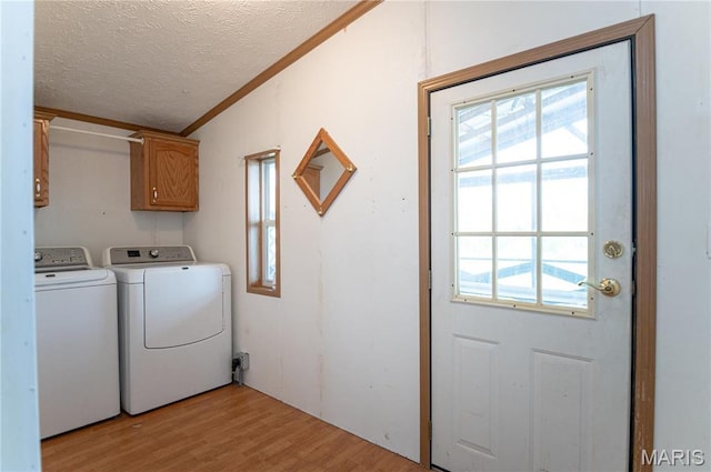751 High St, Edgar Springs, MO 65462 - washroom featuring washer and dryer, cabinet space, a textured ceiling, light wood-style flooring, and ornamental molding
