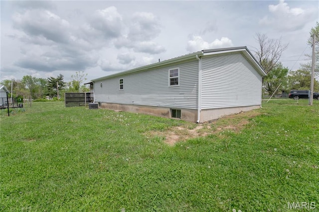 751 High St, Edgar Springs, MO 65462 - view of property exterior with a lawn and central AC unit